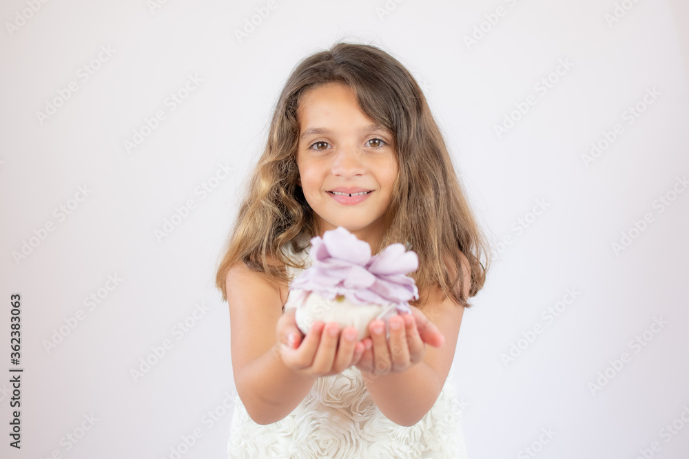 Portrait of a beautiful girl showing a flower Portrait of a beautiful girl showing a flower