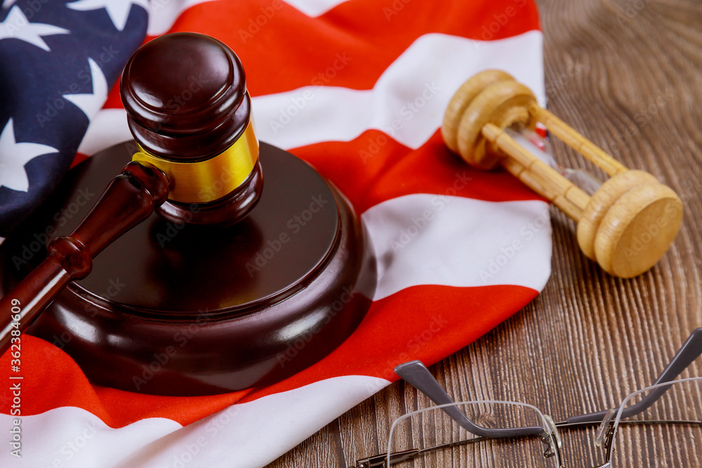 American flag, a US judge legal office with judges gavel on wooden table