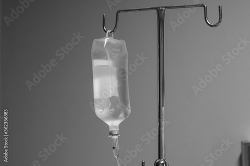 Foto Saline solution hang on metal pole in inpatient room at the hospital