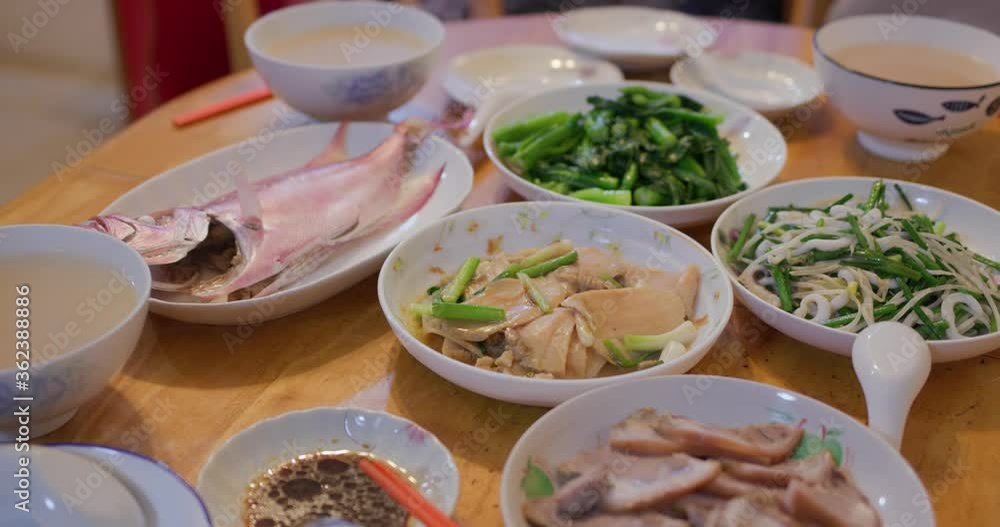 Hong Kong style home cuisine, family dinner concept, steamed fish, fry vegetable and meat Hong Kong style home cuisine, family dinner concept, steamed fish, fry vegetable and meat