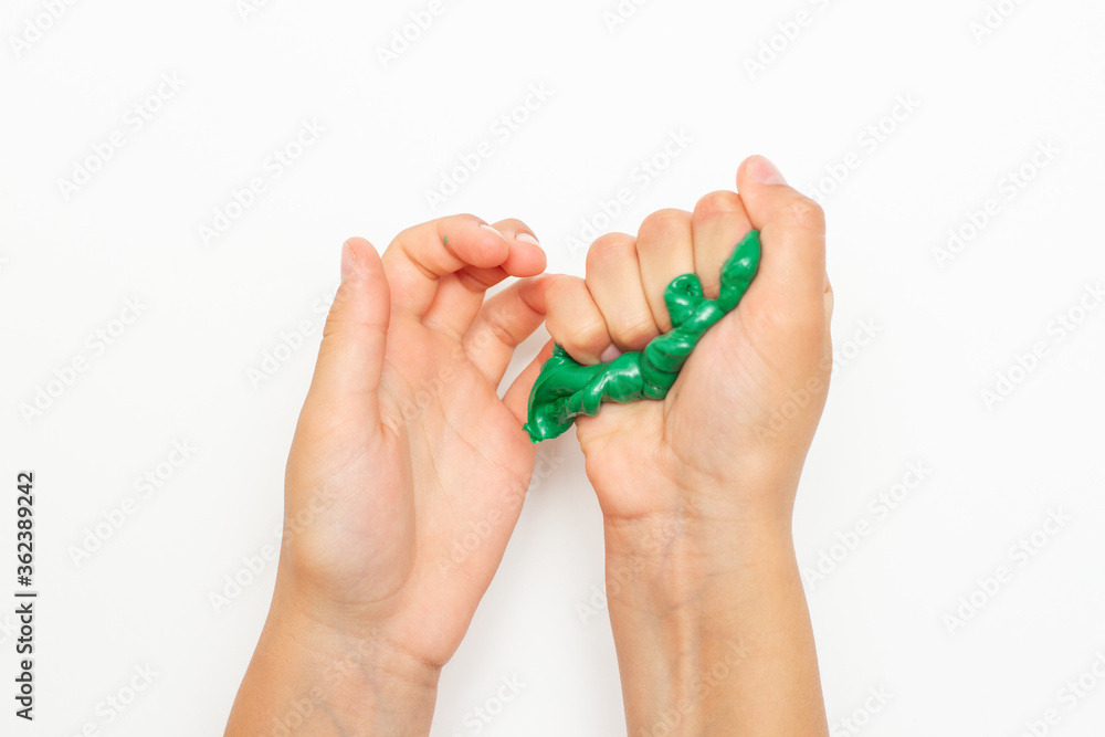 Green slime squeezed in kid's hands Green slime squeezed in kid's hands