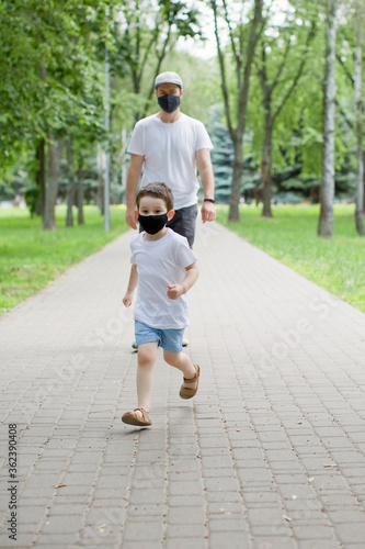 Dad and son in face mask outdoor
