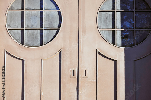 Concept of pareidolia, the psychological phenomenon of appearing similar to a face, this textured grunge architectural detail is seen on an elaborate door. photo