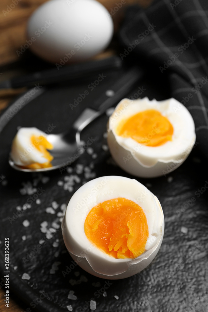 Tasty boiled chicken eggs on slate plate, closeup Tasty boiled chicken eggs on slate plate, closeup