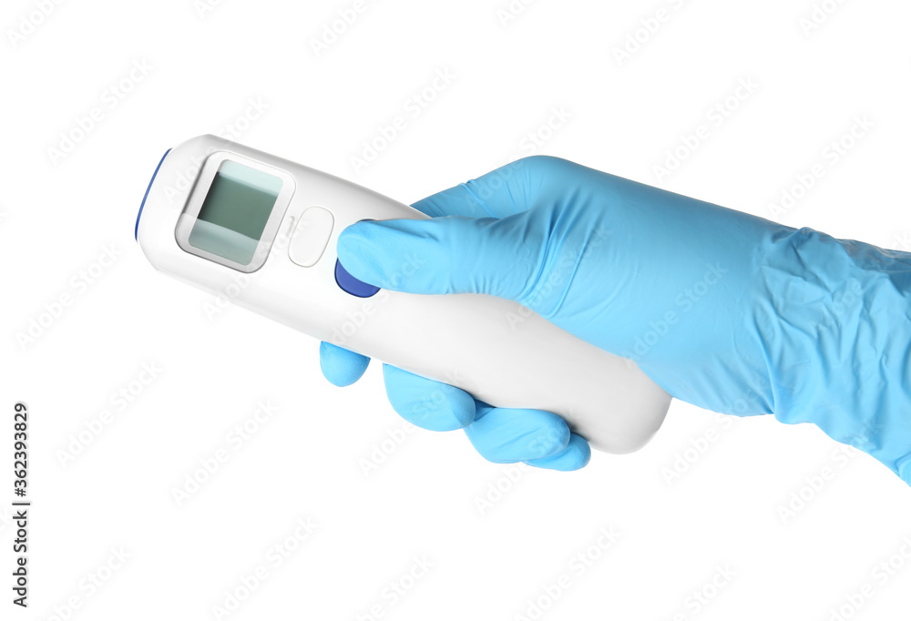 Doctor in latex gloves holding non-contact infrared thermometer on white background, closeup Doctor in latex gloves holding non-contact infrared thermometer on white background, closeup
