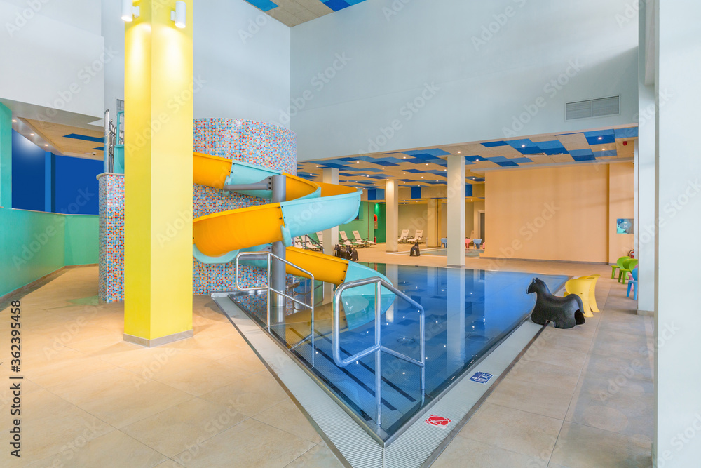 Indoor kids swimming pool in hotel spa and wellness center Indoor kids swimming pool in hotel spa and wellness center
