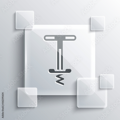 Grey Pogo stick jumping toy icon isolated on grey background. Square glass panels. Vector. photo