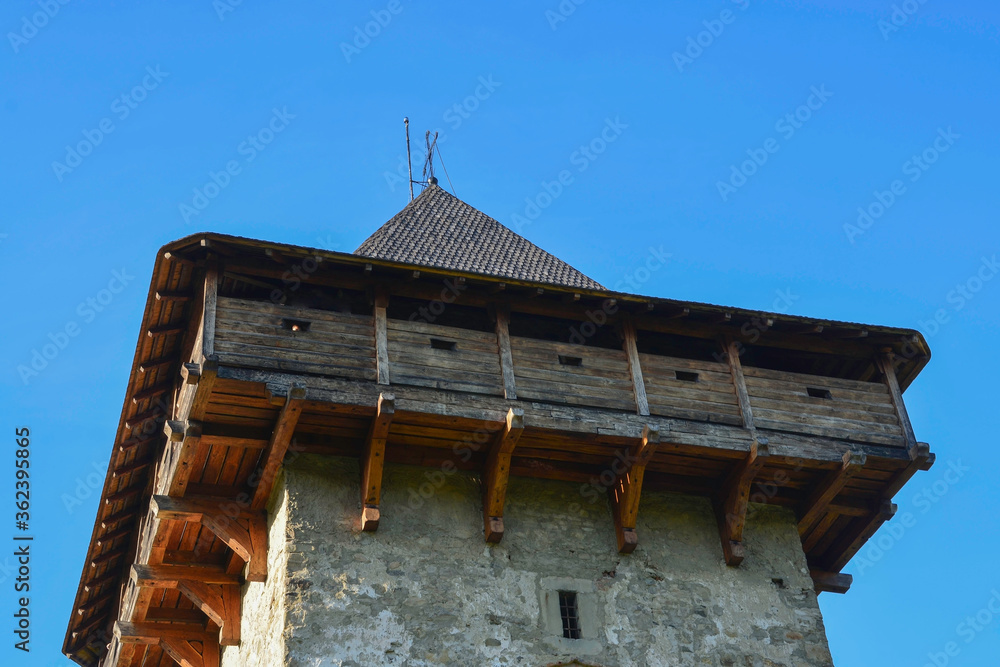 HUMORULUI MONASTERY, BUCOVINA, ROMANIA, EUROPE, SPRING 2018. Medieval stone and wood tower of the Orthodox Humor Monastery.