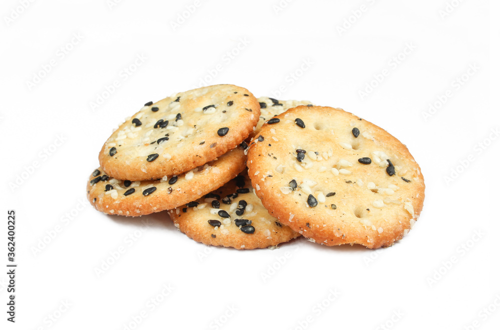 Salty crackers isolated on white background. Tasty snack with sesame seeds Salty crackers isolated on white background. Tasty snack with sesame seeds