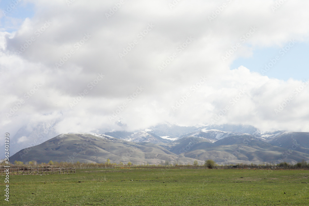 Beautiful mountain landscape. Wildlife Kyrgyzstan. Clouds in the sky. Kyrgyzstan Beautiful mountain landscape. Wildlife Kyrgyzstan. Clouds in the sky. Kyrgyzstan