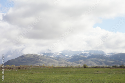Beautiful mountain landscape. Wildlife Kyrgyzstan. Clouds in the sky. Kyrgyzstan