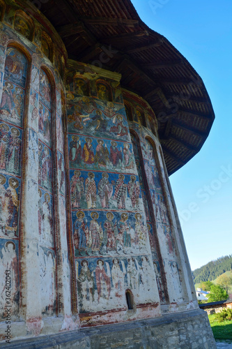 Obraz na płótnie HUMORULUI MONASTERY, BUCOVINA, ROMANIA, EUROPE, SPRING 2018. Orthodox monastery. Moldovan architectural style. Outdoor paintings, frescoes and portraits of saints with Byzantine influence. w salonie