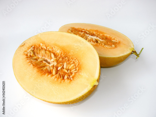 ripe melon cut in half on a light background