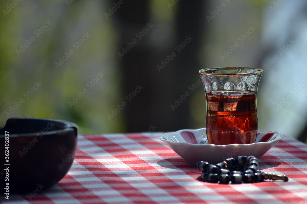 Friendship of tea and rosary at Pier Loti in Istanbul.