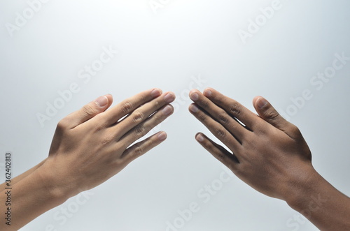 Folded Praying Hands of two person in white background