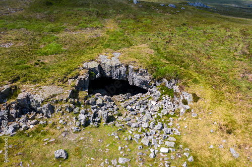 Aerial view of the historic Chartist Cave on isolated moorland in South Wales, UK