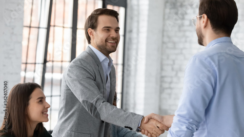 Photos Executive manager welcoming investor during business formal meeting at office board room