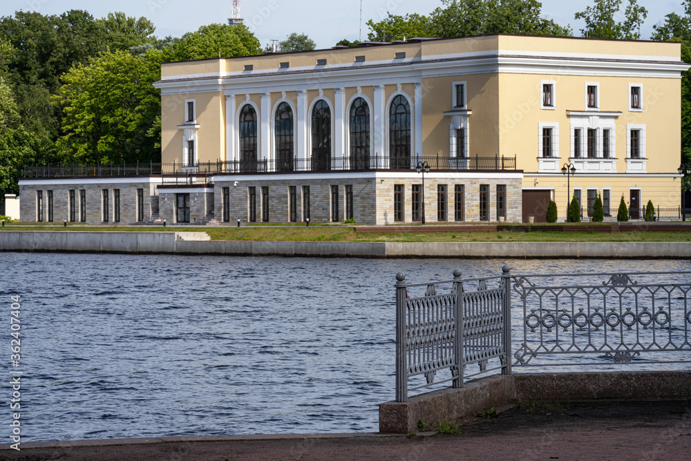 view of the river and an old mansion in the style of classicism