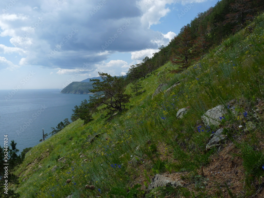 Fototapeta premium Russia, Lake Baikal. Trekking along Lake Baikal through the mountain. Beautiful views of the largest freshwater lake in the world and mountain view.