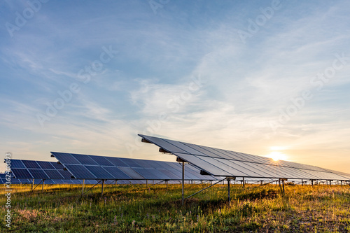 Bild auf Leinwand ground mounted photovoltaic power station at sunset