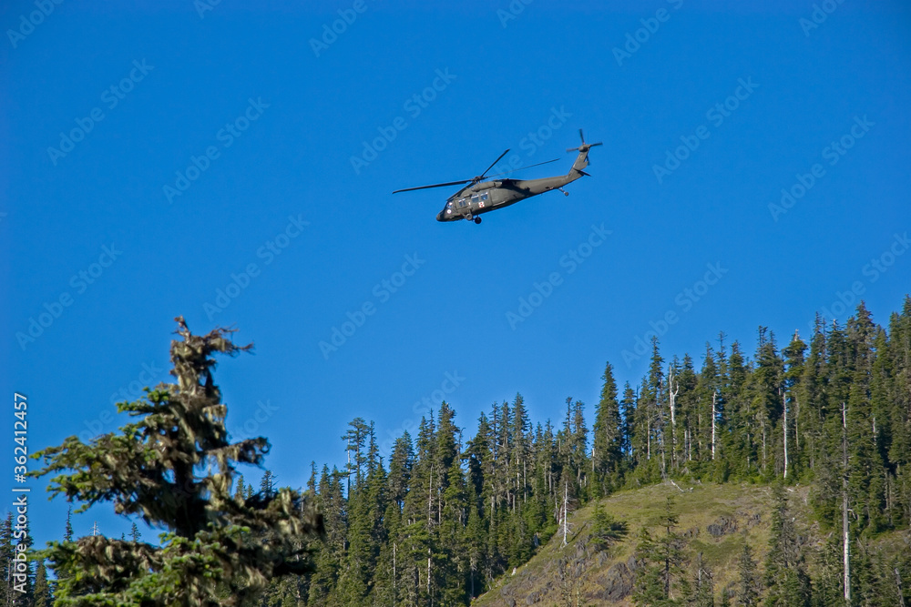 Detroit, Oregon, An Oregon National Guard helicopter (HH-60M Black Hawk) lifting an injured hiker from the Willamette National forest near Detroit. Detroit, Oregon, An Oregon National Guard helicopter (HH-60M Black Hawk) lifting an injured hiker from the Willamette National forest near Detroit.