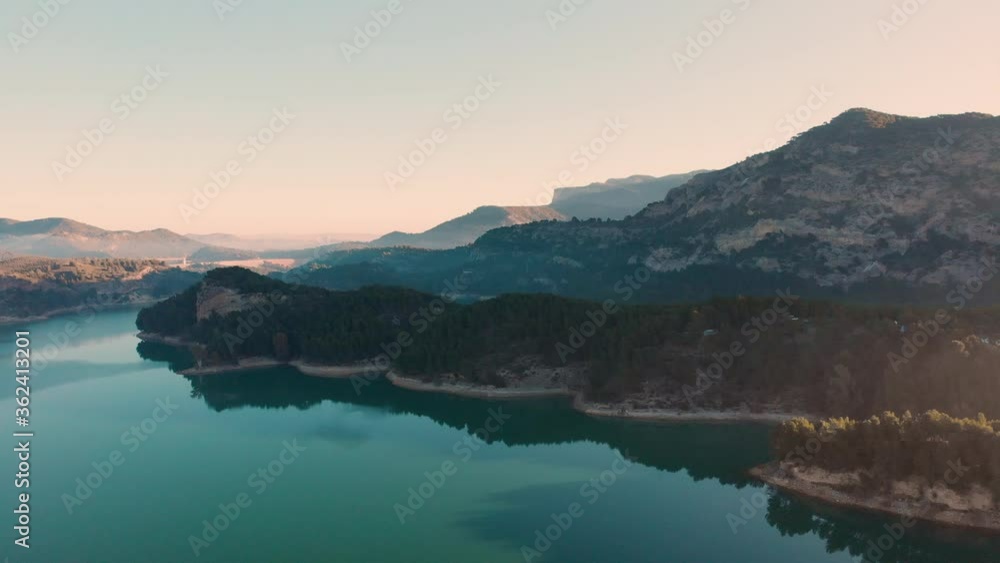 Beautiful Blue Ocean And Coastal Mountains With Green Forest At Sunrise In Athens, Greece. - aerial drone shot Beautiful Blue Ocean And Coastal Mountains With Green Forest At Sunrise In Athens, Greece. - aerial drone shot