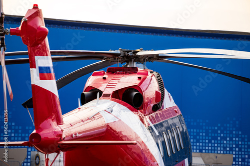 Modern helicopter with rotor blades and tail rotor part close up