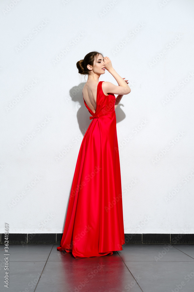 Portrait of girl in waiving red silk dress Portrait of girl in waiving red silk dress