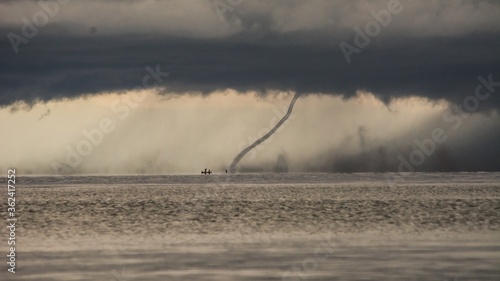 Cuadro en lienzo Upcoming storm with tornado hitting the water at lake malawi