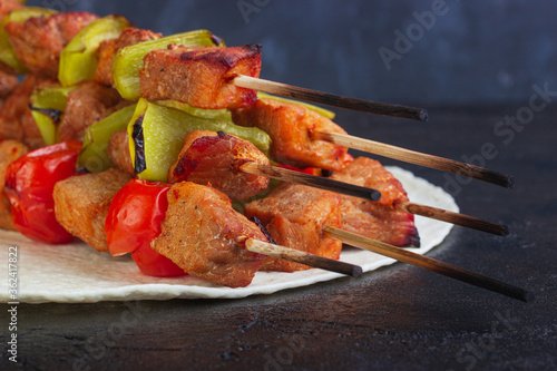 Baking pork with Bulgarian peppers and cherry tomatoes on skewers