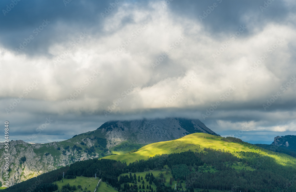 Some light over the mountain in a cloudy day
