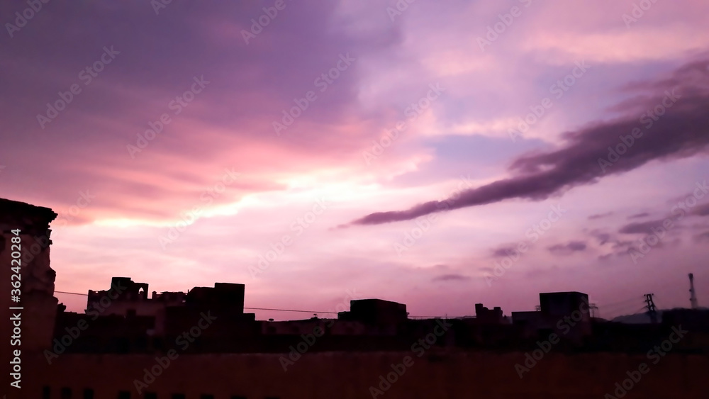 An Image of Purple clouds in a Purple Sky During Sunset