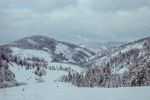 A man standing on top of a snow covered mountain © Дмитро Григорчак