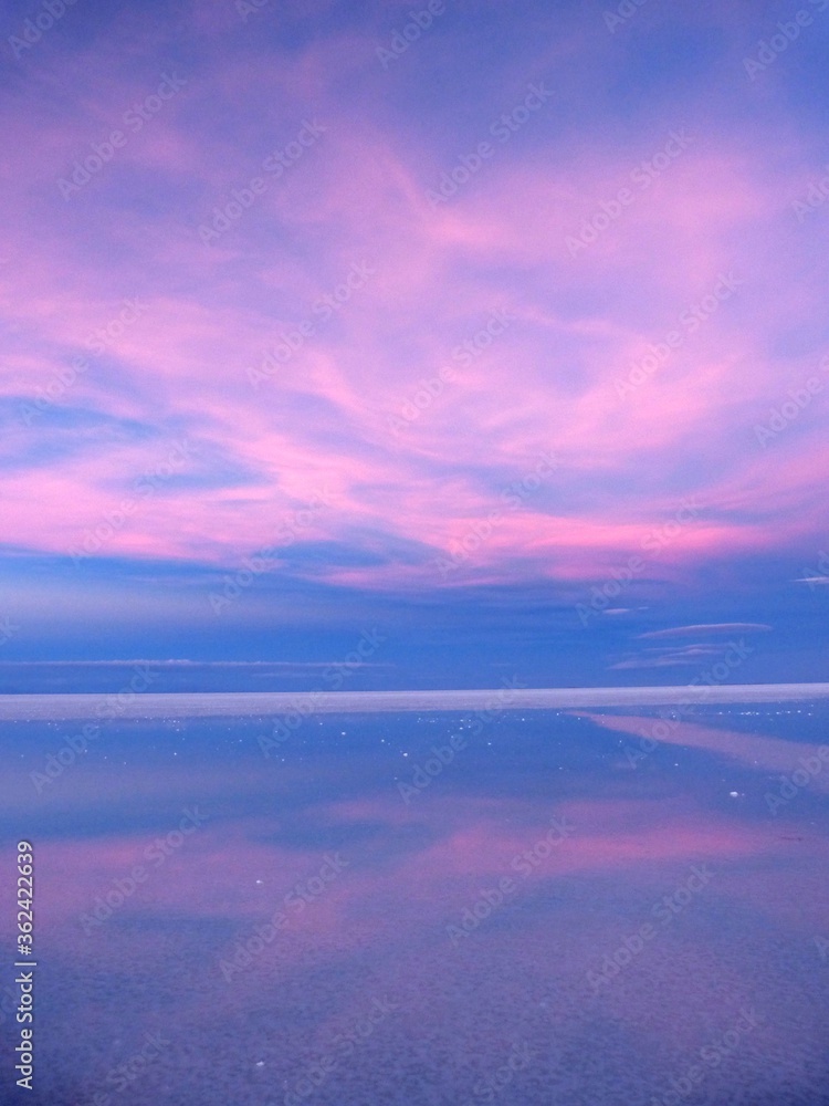 Fairytale pink sunset. Saline salar Uyuni in Bolivia, South America.