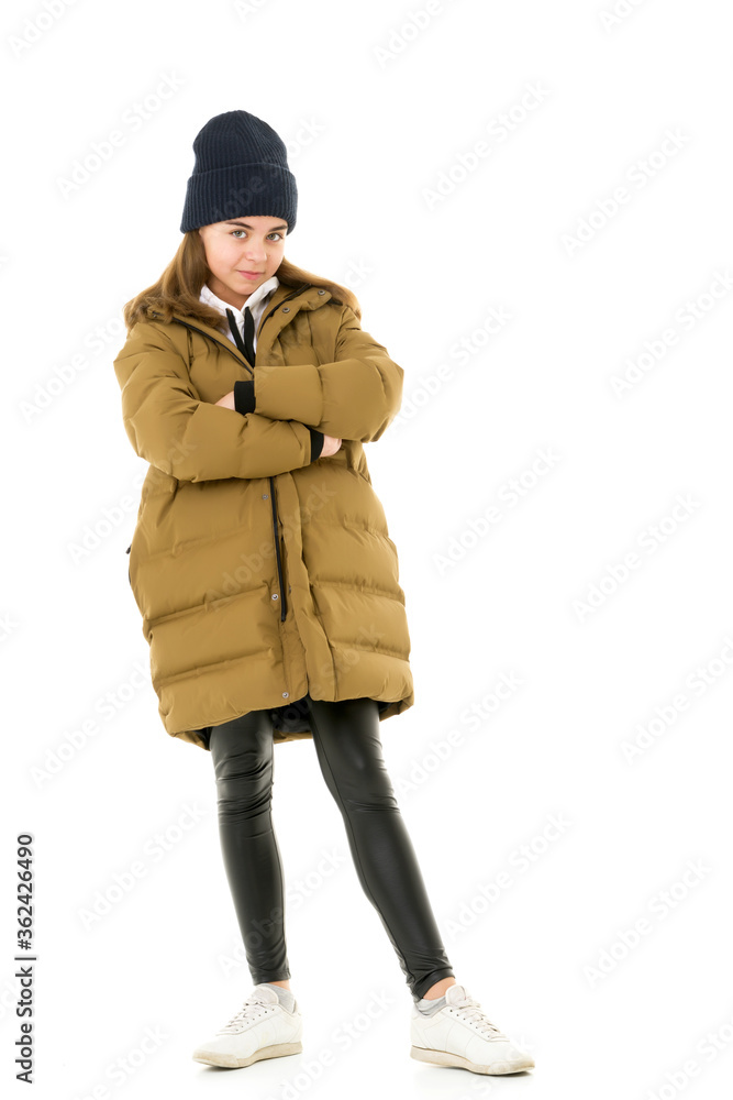 Beautiful little girl in a fashionable coat.