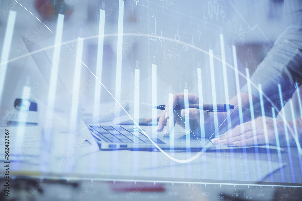 Multi exposure of woman hands typing on computer and financial chart hologram drawing. Stock market analysis concept.
