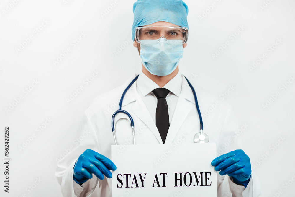 close up. doctor showing the ad stay at home. close up. doctor showing the ad stay at home.