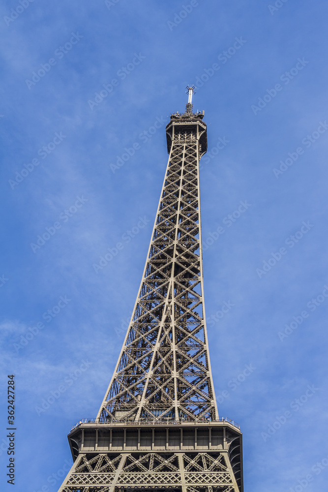 Eiffel Tower (La Tour Eiffel) located on Champ de Mars in Paris, named after engineer Gustave Eiffel. Eiffel Tower is tallest structure in Paris and most visited monument in world. Paris, France.