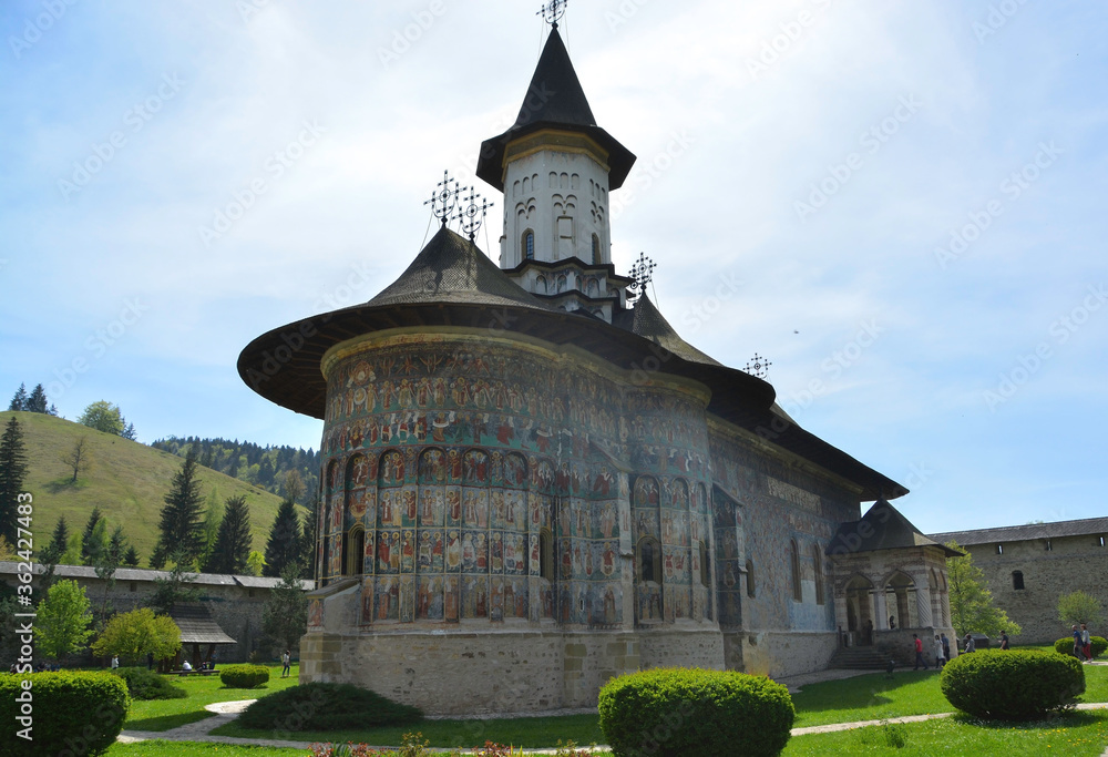 SUCEVITE MONASTERY, BUCOVINA, ROMANIA, EUROPE, SPRING 2018. Orthodox monastery. Moldovan architectural style. Open-air paintings, frescoes and portraits of saints with Byzantine influence.