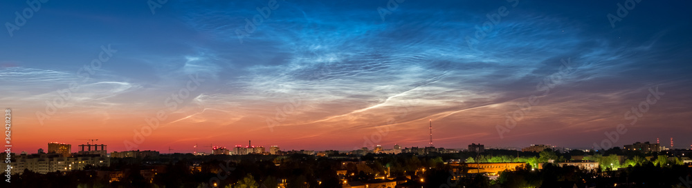 Sunrise Cityscape. Beautiful sky and clouds, night illumination of houses. Vladimir city, Russia