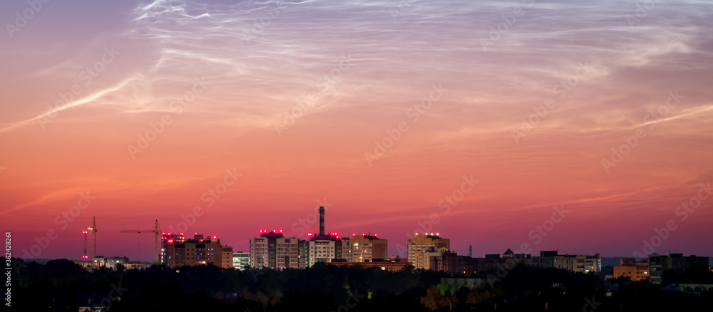Fototapeta premium Sunrise Cityscape. Beautiful sky and clouds, night illumination of houses. Vladimir city, Russia