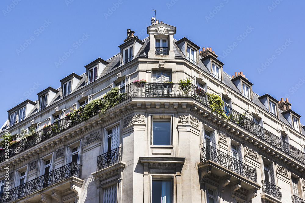 Old French house with traditional balconies and windows. Paris, France. Old French house with traditional balconies and windows. Paris, France.