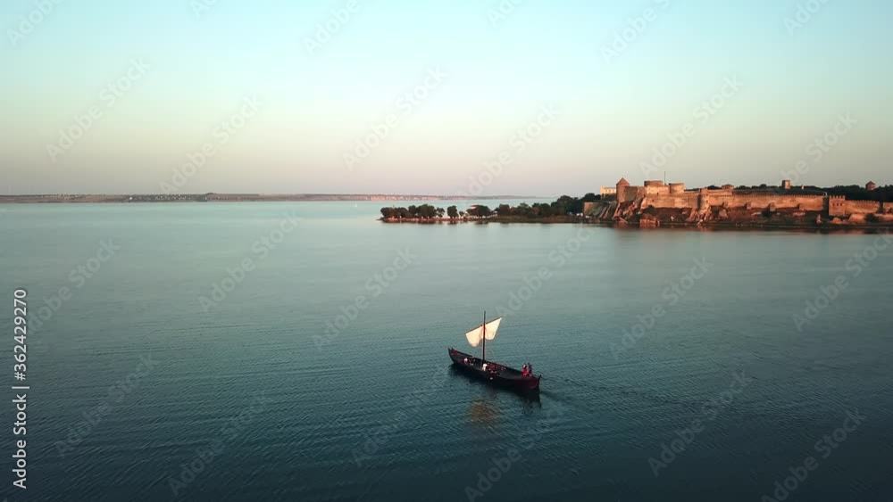 aerial view of old sailing ship at sunset, aerial view of old sailing ship at sunset on the fortress background, Silhouette of the ancient sailing ship at sunset aerial aerial view of old sailing ship at sunset, aerial view of old sailing ship at sunset on the fortress background, Silhouette of the ancient sailing ship at sunset aerial