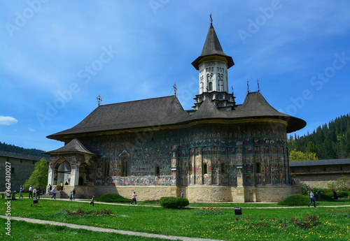 SUCEVITE MONASTERY, BUCOVINA, ROMANIA, EUROPE, SPRING 2018. Orthodox monastery. Moldovan architectural style. Open-air paintings, frescoes and portraits of saints with Byzantine influence.
