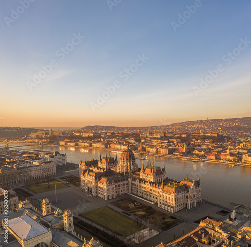 Aerial drone shot of Hungarian Parliament lights off before sunrise in Budapest dawn