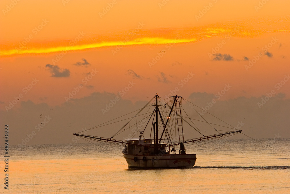A shrimp boat off St Simons Island, Georgia at sunset.
