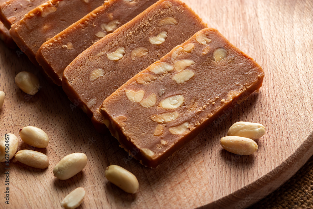 Peanut sorbet on a wooden background. Vegetarian sweet with nuts. Peanut sorbet on a wooden background. Vegetarian sweet with nuts.