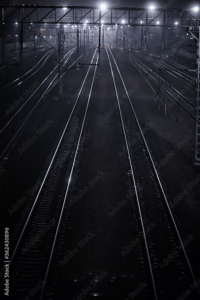 Fototapeta premium railway tracks night landscape at the railway station fog autumn