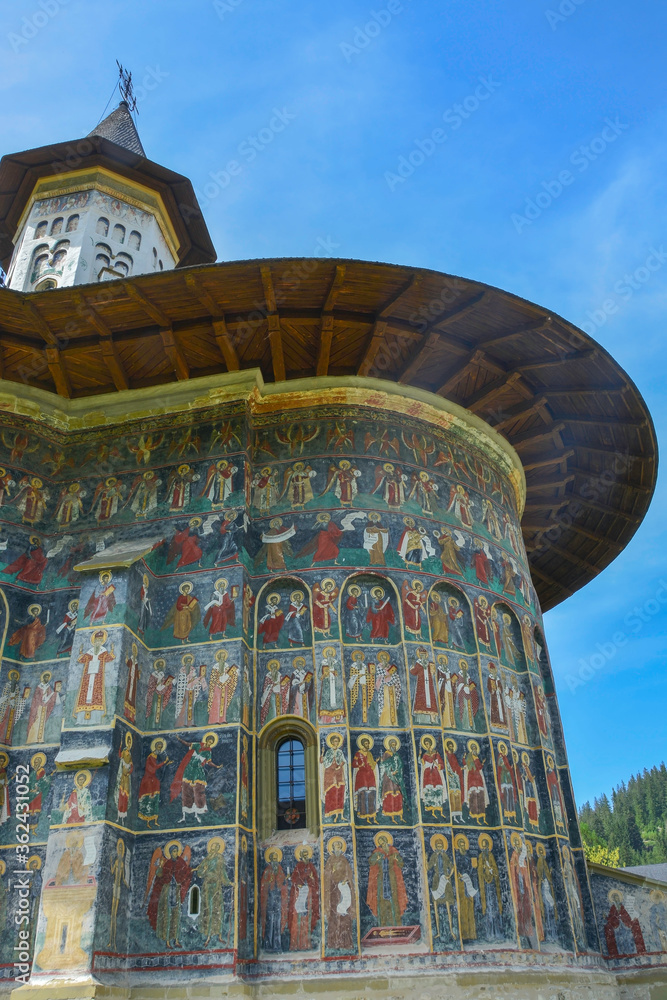 SUCEVITE MONASTERY, BUCOVINA, ROMANIA, EUROPE, SPRING 2018. Orthodox monastery. Moldovan architectural style. Open-air paintings, frescoes and portraits of saints with Byzantine influence.
