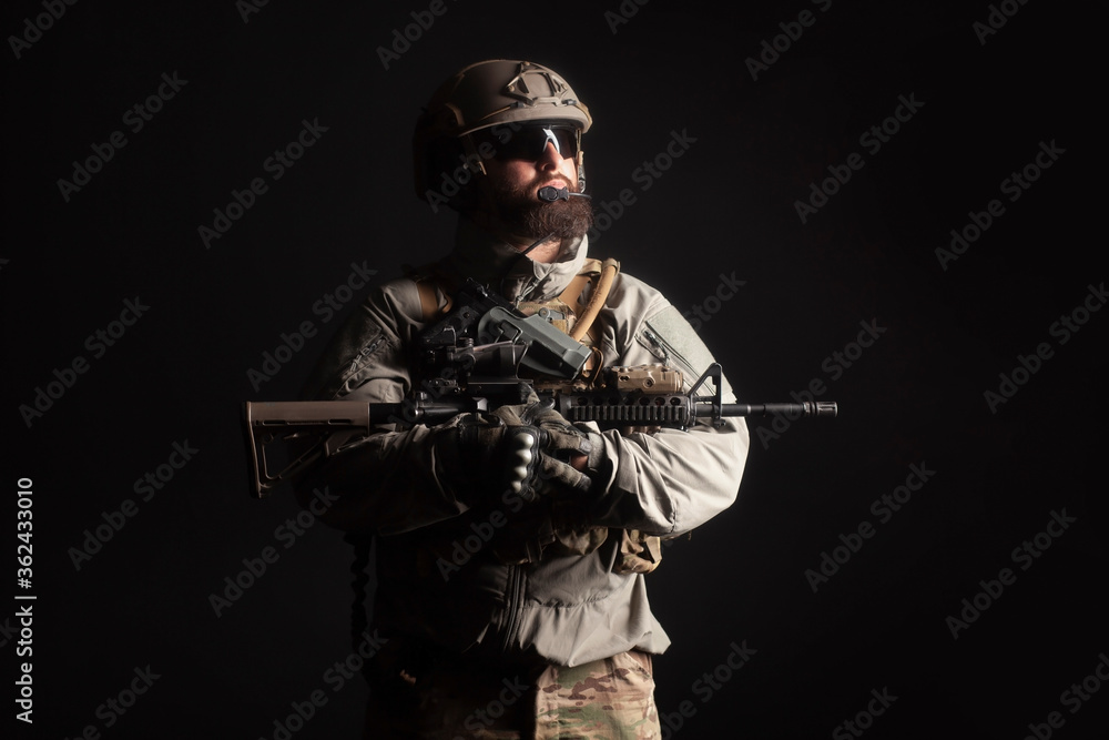 portrait of special forces in a military uniform with weapons at night, elite troops, counter terrorist against a dark background portrait of special forces in a military uniform with weapons at night, elite troops, counter terrorist against a dark background